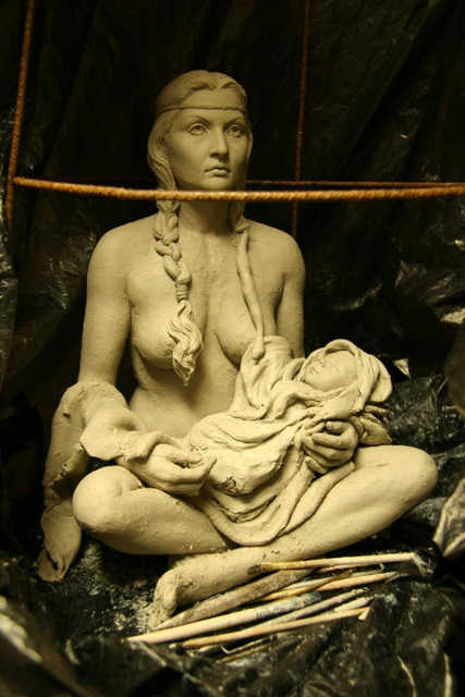 Indian woman (maiden) holding her baby.