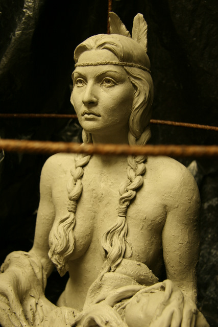 Indian woman with braids closeup.