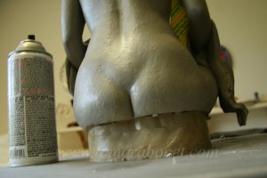 The underneath back portion of the sculpture.
