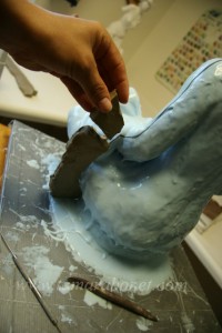 Add oil based clay to make a wall along parting line.