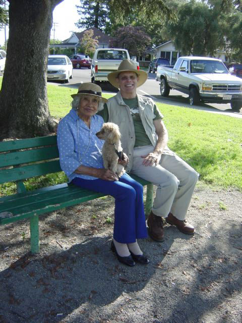 Luisa and Ron on a park bench.