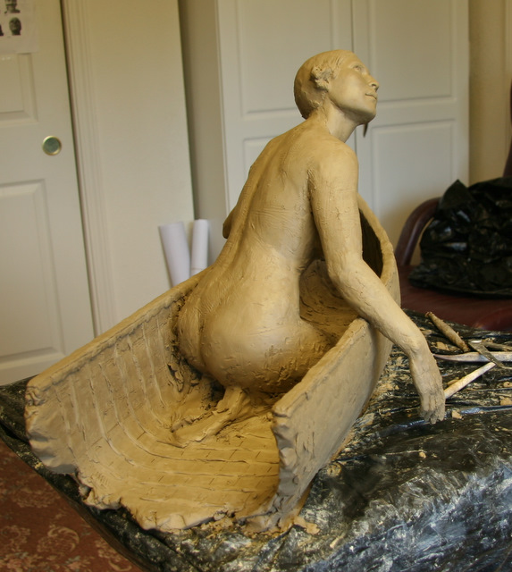American Indian woman's sculpted nude back view.