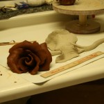 Large terracotta red rose ceramic clay flower.