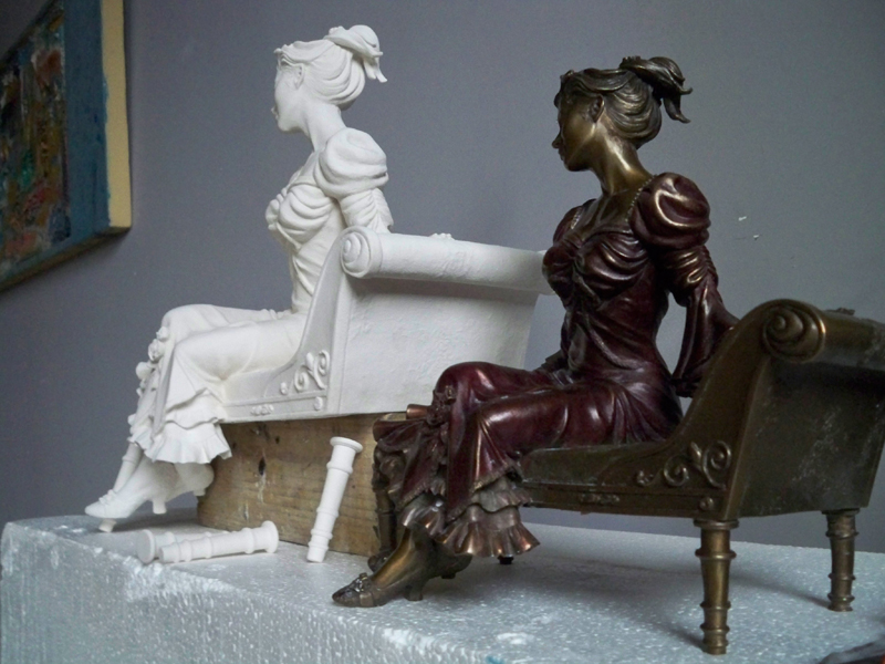 Side view of bronze and sculpture enlargement.