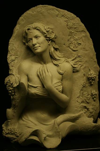 Clay relief with limbs missing.