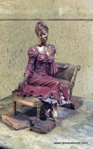 Brightness of the dress and ruffles will change once wax is applied to warm bronze.